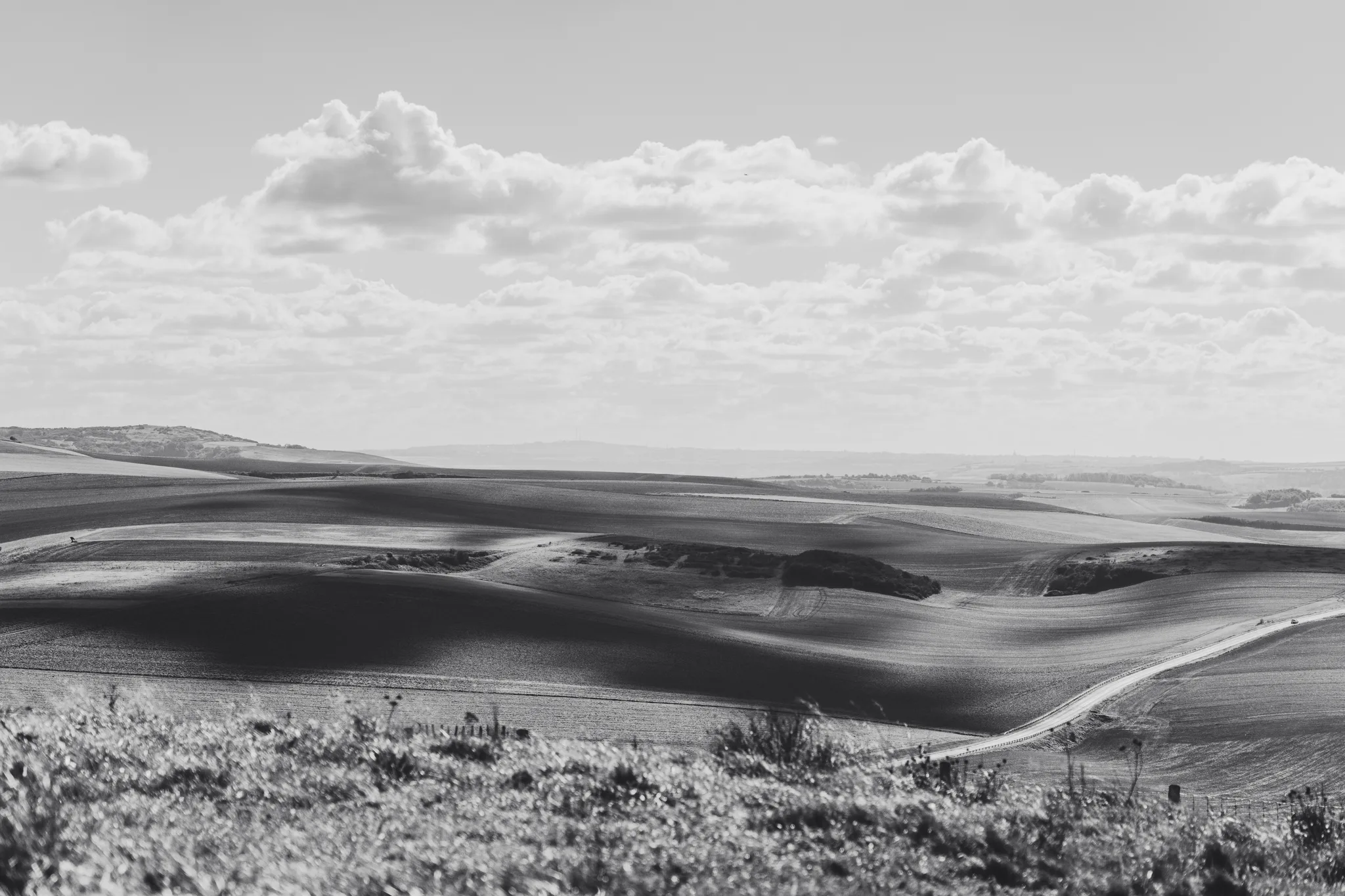 Rolling fields and a winding road below Cap Blanc-Nez, black and white
